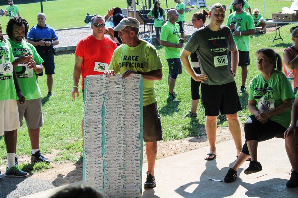 shows results board with pull tags at the end of a race